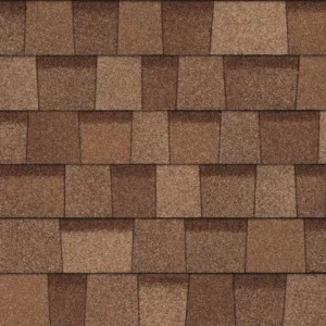 Close-up of a patterned brown shingle roof displaying various shades, textures, and hail damage.