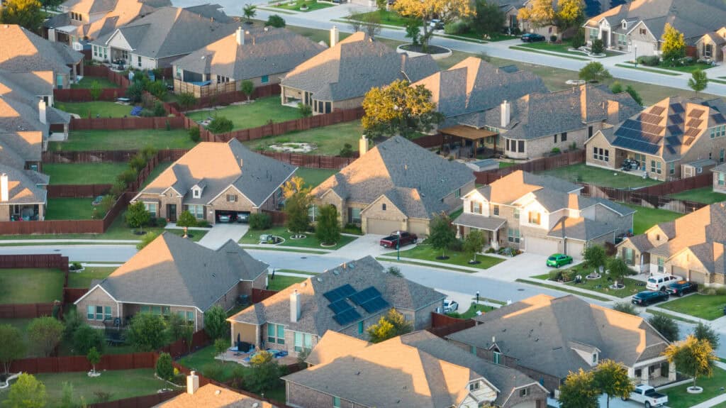 aerial view of asphalt shingle roofs - what to know about replacing a roof in Austin