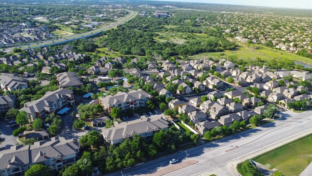 Aerial view of residential neighborhood with high-quality shingle roofing