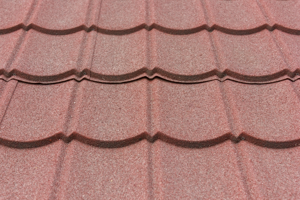 Red metal tile roof close-up showcasing durability and longevity, ideal for commercial buildings.